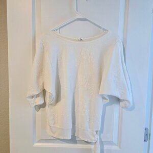 White Maurice's dolman top with tie waist and floral detail